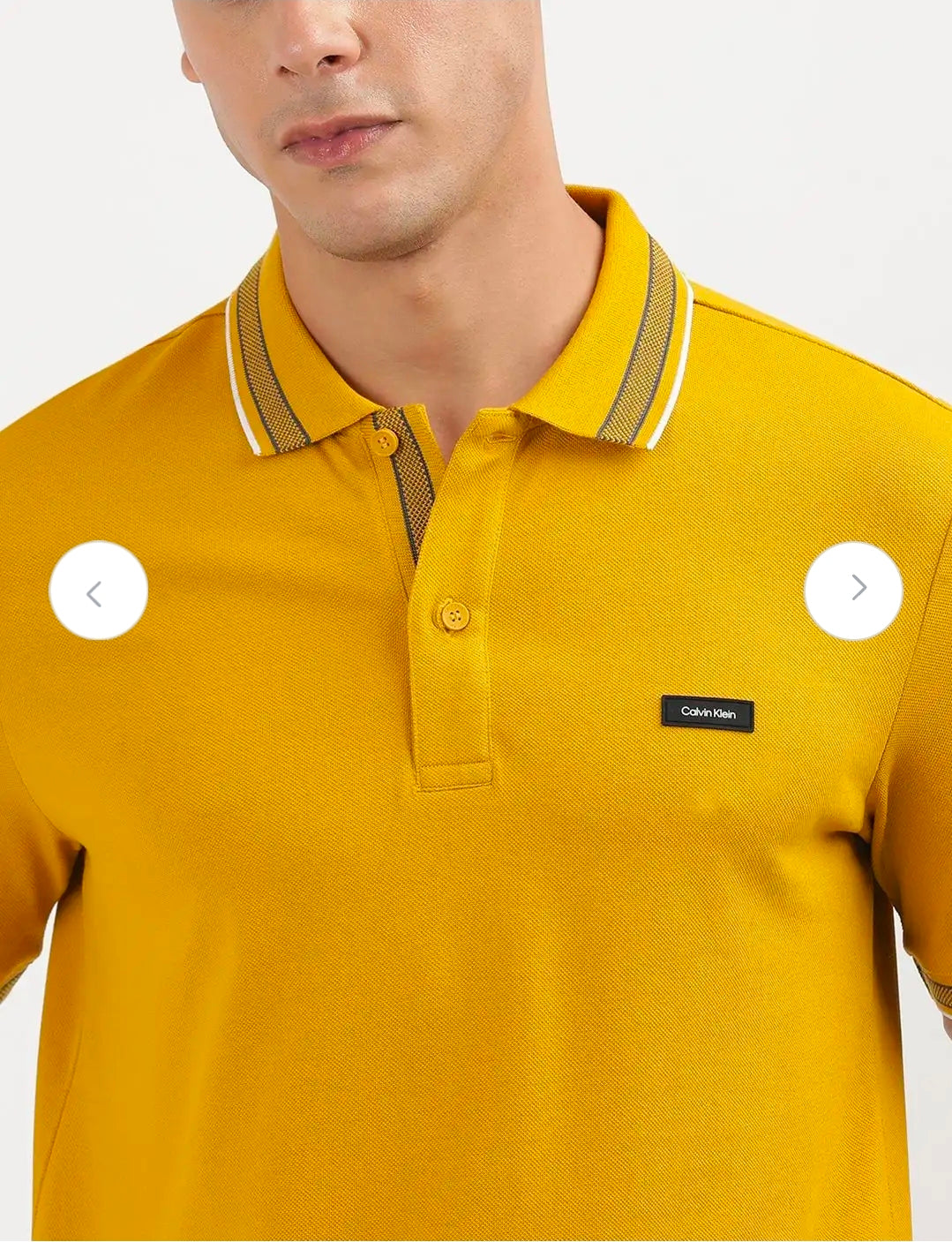 Calvin Klein stretch pique tipped polo.