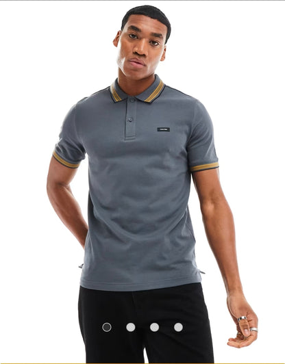 Calvin Klein stretch pique tipped polo.
