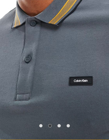 Calvin Klein stretch pique tipped polo.