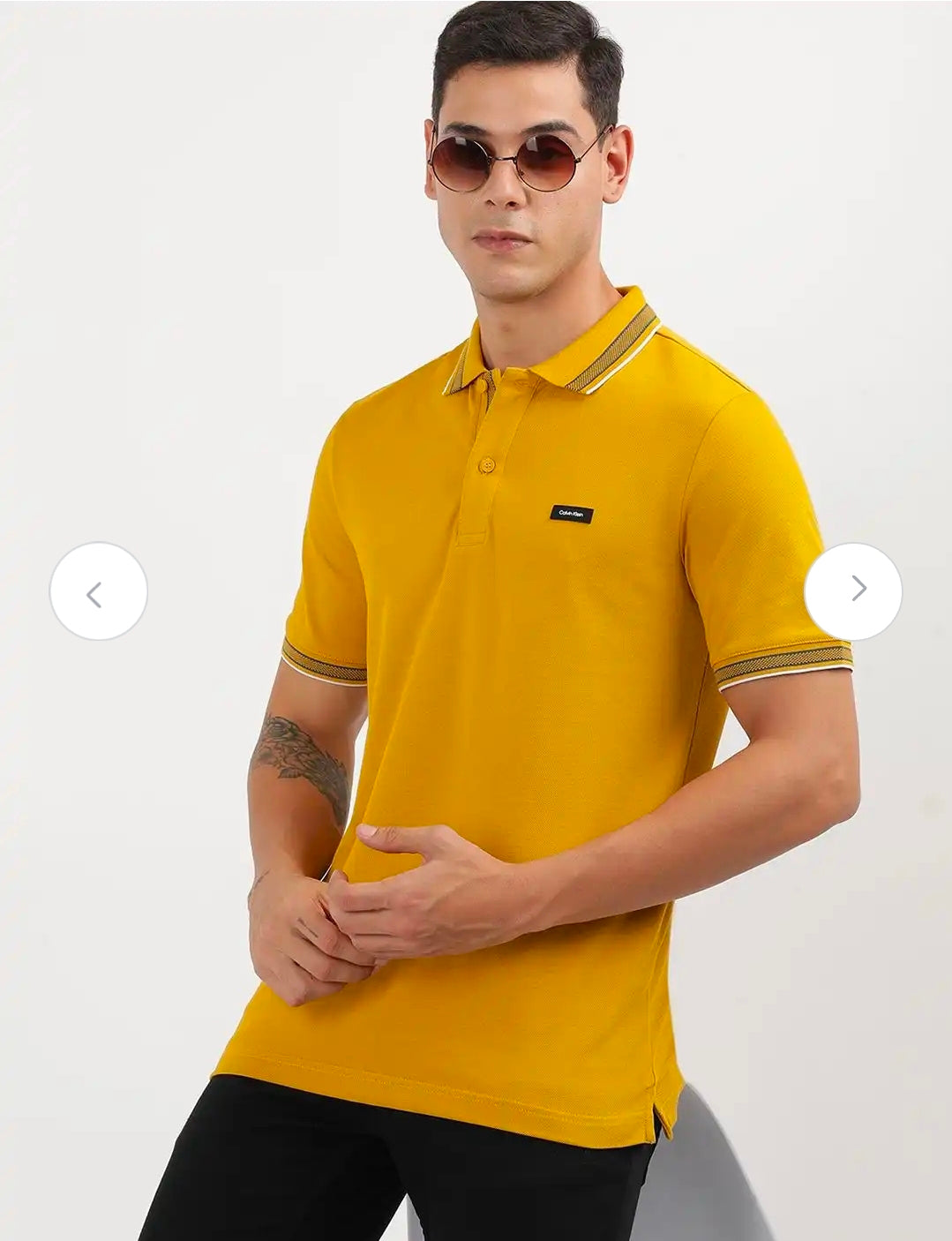 Calvin Klein stretch pique tipped polo.